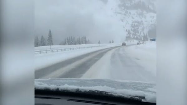 Cloud of snow blankets Colorado highway after avalanche