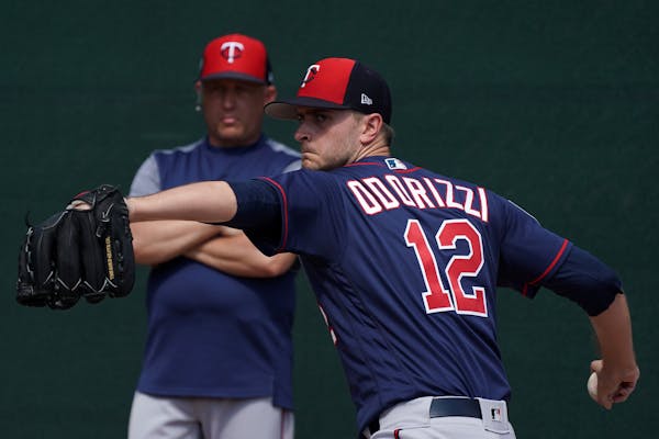 Jake Odorizzi delivered a pitch in the bullpen Tuesday at the Twins complex under the watchful eye of pitching coach Wes Johnson.