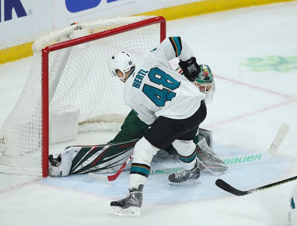Sharks center Tomas Hertl slipped the puck over the skate of Wild goaltender Devan Dubnyk in the third period for San Jose's second goal in a 3-0 vict