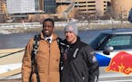 St. Paul Mayor Melvin Carter and snowmobile racer Levi LaVallee after their 12,000-foot parachute jump onto Harriet Island Tuesday.
