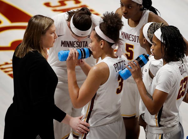 Gophers head coach Lindsay Whalen spoke to players during a home game in January.
