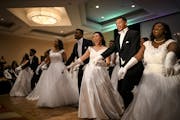 Lillyan Stuart, a junior at Roseville, danced with her escort, AJ Scaife, with their fellow debutantes and escorts.