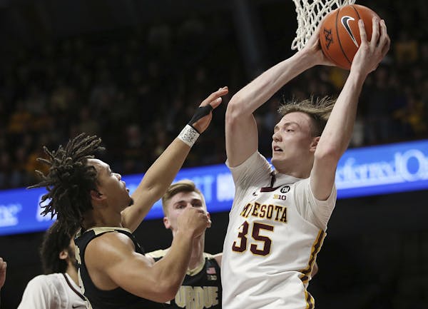 After not playing in the previous three games, Gophers center Matz Stockman (35) came through with nine points, six rebounds and seven blocks in a 73-