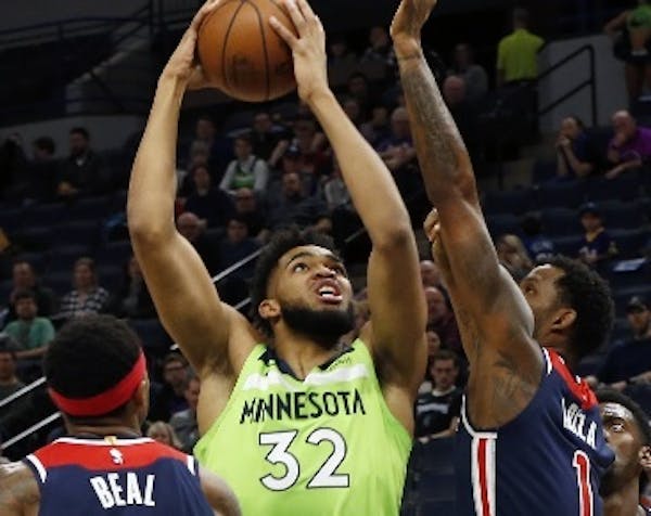 Wolves center Karl-Anthony Towns had 40 points and 16 rebounds against the Wizards on Saturday night, but missed the end of the fourth quarter and ove