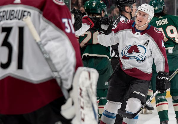 Tyson Barrie celebrated with his Avalanche teammates after scoring a goal against the Wild in the first period at Xcel Energy Center on Tuesday night.