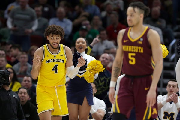 Michigan's Isaiah Livers reacts after making a shot during the second half against the Gophers in the semifinals of the Big Ten tournament