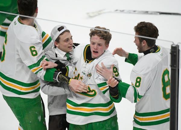 Edina forward Peter Colby (9) was overcome with emotion after scoring the game-winner in overtime for a 3-2 victory over Eden Prairie for the Class 2A