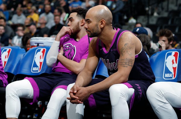 Timberwolves guards Jerryd Bayless, front, and Tyus Jones