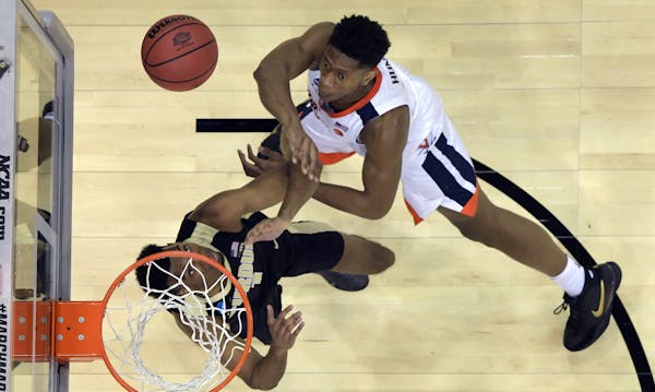 Virginia guard De’Andre Hunter, at 6-7, had no reservations about taking the action to 6-9 Purdue forward Aaron Wheeler in the South Region champion
