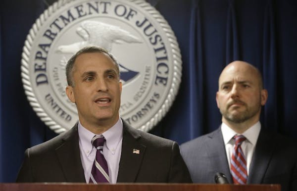 FBI Special Agent in Charge Boston Division Joseph Bonavolonta, left, and U.S. Attorney for District of Massachusetts Andrew Lelling, right, face repo