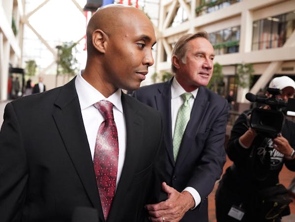 Mohamed Noor, accompanied by his legal team, Peter Wold, and Tom Plunkett left after a probable cause hearing for the ex-Minneapolis cop Thursday at t