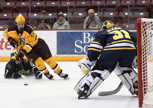 Gophers forward Tommy Novak skated at Michigan goalie Strauss Mann. Novak scored the game’s first goal at 5:25 of the opening period.