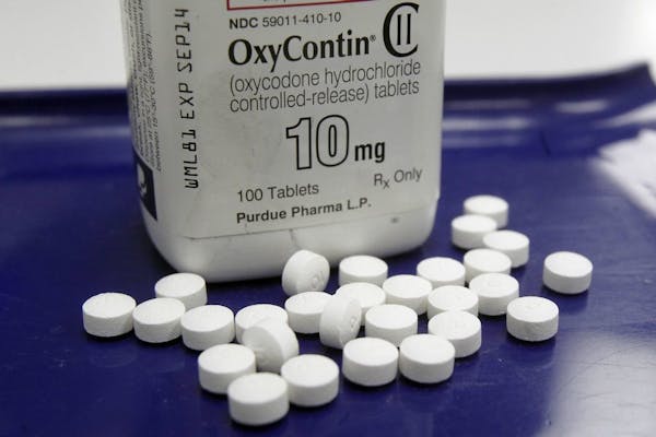FILE - This Feb. 19, 2013 file photo shows OxyContin pills arranged for a photo at a pharmacy in Montpelier, Vt.