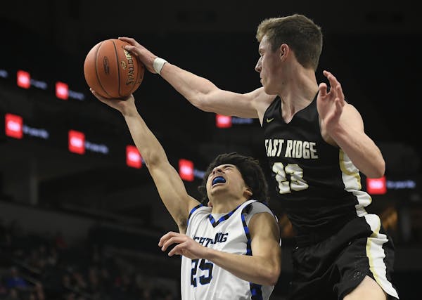 East Ridge forward Ben Carlson blocked a layup attempt by Eastview guard Caden Scales in the first half. Carlson had 11 points, seven rebounds and thr