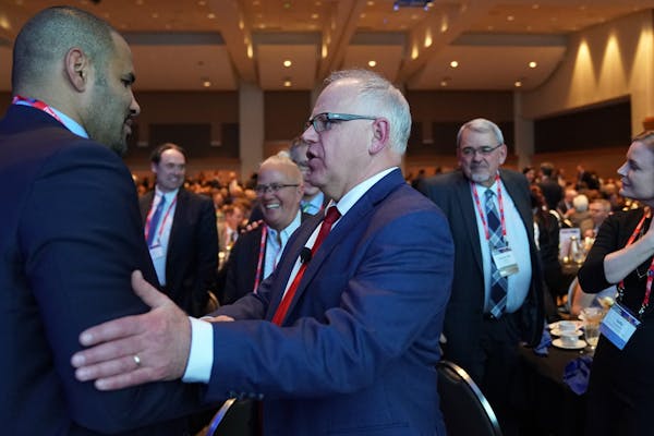Gov. Tim Walz spoke with Tony Sanneh of the Sanneh Foundation during the Minnesota Chamber of Commerce's annual policy kickoff event in January in St.