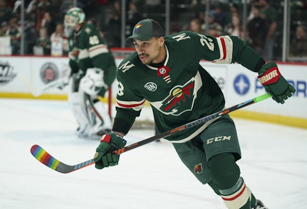 Wild right wing J.T. Brown was among several players who warmed up with stick blades taped with rainbow colors on the night of the Wild’s annual “