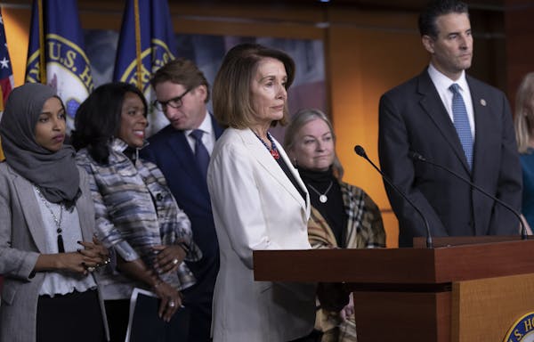 U.S. Rep. Ilhan Omar, far left, and U.S. Rep. Dean Phillips, third from left, participate in a press conference of House Democrats in November 2018. (