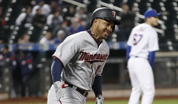 The Twins' Jonathan Schoop rounded the bases after hitting a sixth-inning solo home run -- his first of two homers, and one of six hit by the Twins --