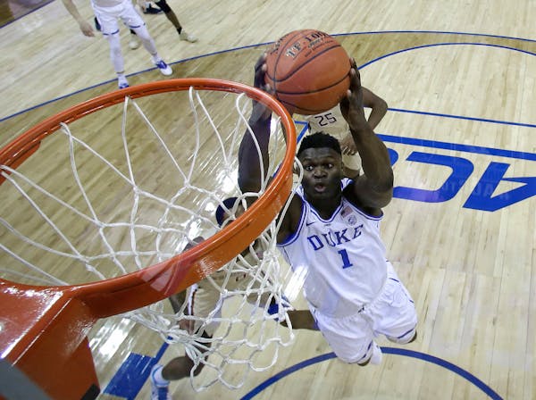 Duke's Zion Williamson (1) goes up to dunk against Florida State during the first half of the championship game of the Atlantic Coast Conference