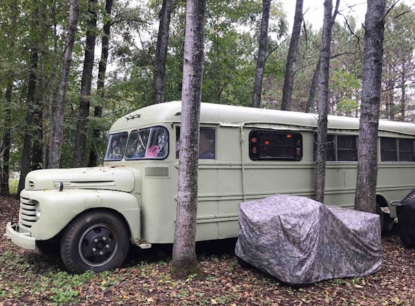 Converted into a wood-paneled camper on wheels, the 1940-something Ford bus was bought in the 1960s.