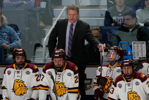 Minnesota Duluth coach Scott Sandelin, shown during the NCAA championship game against Massachusetts on Saturday, has guided the Bulldogs to three nat