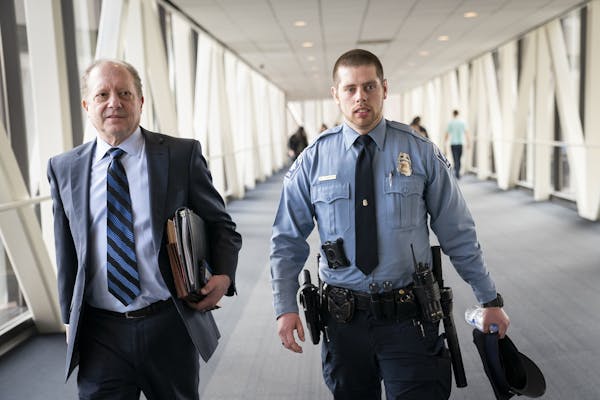 Minneapolis police officer Matthew Harrity leaves the courtroom for lunch break with his attorney Fred Bruno.