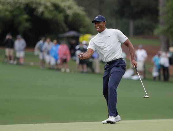 Tiger Woods led his own electric charge at Augusta, where he enters the weekend one shot off the lead.