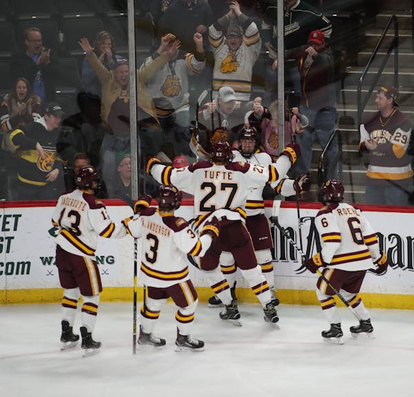 In this photo from the NCHC tournament in St. Paul, Minnesota-Duluth celebrated a goal vs. Denver.