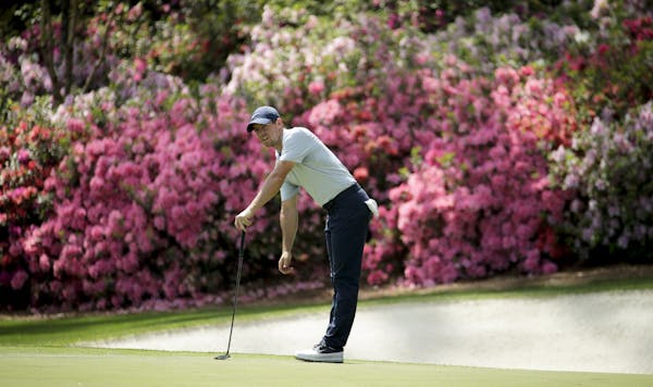 Rory McIlroy, of Northern Ireland, watches his putt on the 13th hole during a practice round for the Masters golf tournament Monday, April 8, 2019, in