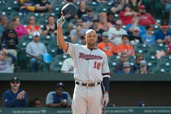The Twins' Jonathan Schoop tips his helmet to the Baltimore crowd Saturday.