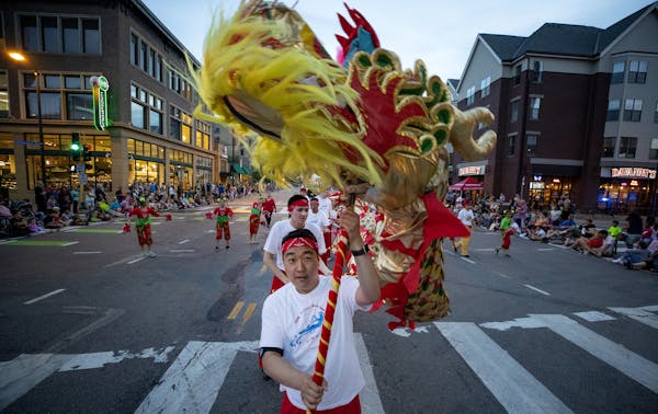 Parades, festivals and races draw crowds to Hennepin Avenue each year. Here, members of CAAM Chinese Dance Theater performed during the 2018 Aquatenni