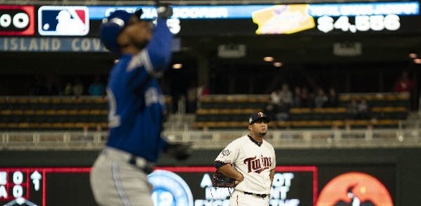 Twins reliever Adalberto Mejia watched as Blue Jays left fielder Teoscar Hernandez headed home after he connected for a three run homer in the eighth 