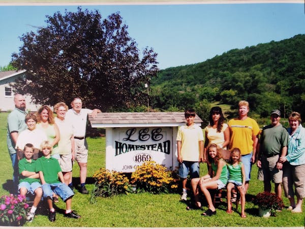 The descendants of John Lee posing on the farm he founded in Houston County in 1869 after he immigrated from Norway. The Lee Farm was one of 47 recogn
