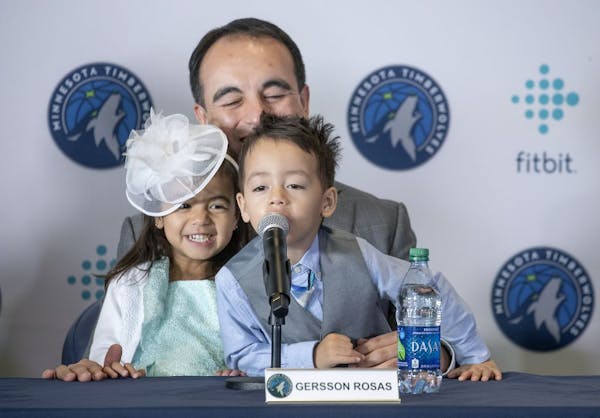 New Timberwolves President of Basketball Operations Gersson Rosas laughed as his 3-year-old twins Giana, left, and Grayson took over the microphone as