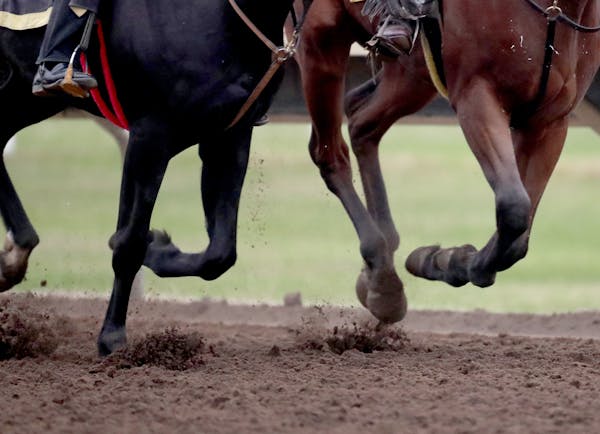 Exercise riders and jockey trained horses on the track at Canterbury Park ahead of the 2019 meet season opening in early May.