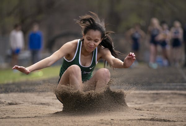Robbie Grace landed on her third and final jump of a meet on May 2 at The Blake School in Hopkins. Photo: JEFF WHEELER • jeff.wheeler@startribune.co