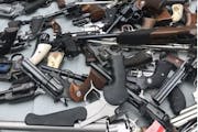 Guns seized during a raid by law enforcement officials.