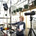 Diana Pierce worked with partner and “What’s Next?” technical director Scott Bemman to set up for a videocast from Heidi’s GrowHaus in Corcora
