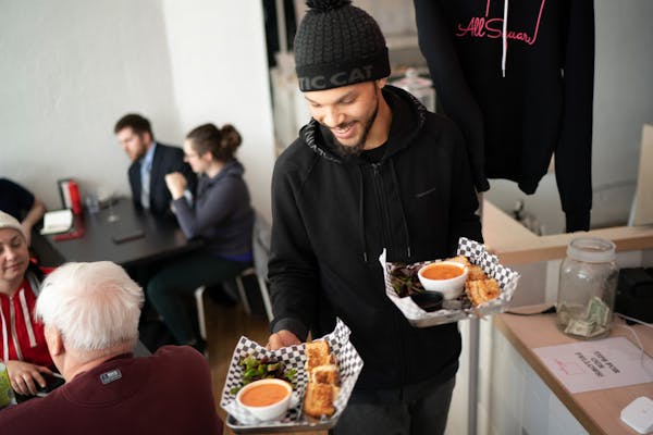 All Square fellow Tomas Reynolds delivered sandwiches to customers. He hopes to put his culinary talent to use by opening a food truck someday. “I t