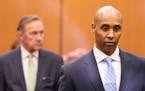 Former Minneapolis police officer Mohamed Noor walked through the elevator lobby of the Hennepin County Government Center with his legal team on Frida