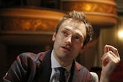 FILE - In this April 5, 2016, file photo, Chris Thile speaks during an interview at the Fitzgerald Theater in St. Paul, Minn. Thile, who replaced Garr