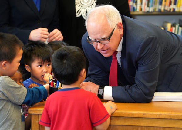 Under the watchful eye of pre-K children at Bruce Vento Elementary School in St. Paul, Gov. Tim Walz signed the state’s school funding bill into law