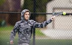 Minneapolis Edison tennis player Logan Couillard returned a shot while he played in a match against Minneapolis South on May 6 in Minneapolis. Photo: 