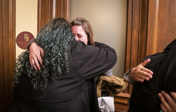 Sexual assault survivor and activist Sarah Super, right, hugged Rep. Aisha Gomez, D-Minneapolis, after testifying Thursday.