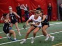 Senior Brooke Lewis of Eden Prairie, shown here surrounded by Chanhassen players in an April 30 game, said a victory this season over Prior Lake aveng