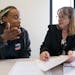 Kamarra Johnson met with attorney Barbara White, right, an attorney with Target Corp. during an eviction expungement legal clinic. Johnson is trying t