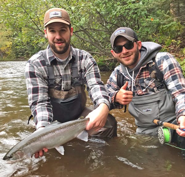 Brock Haugrud, left, 28, of Duluth, and Toby Halley, 26, of Northfield, Minn., are river fishing friends.