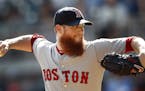 FILE - In this Sept. 3, 2018, file photo, Boston Red Sox relief pitcher Craig Kimbrel works against the Atlanta Braves in the ninth inning of baseball