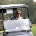 John Daly drives a cart to the ninth green during the first round of the Father Son Challenge golf tournament Saturday, Dec. 15, 2018, in Orlando, Fla