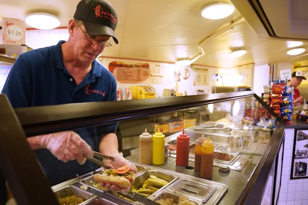Dave Magnuson served up a Chicago-style hot dog from his Walkin’ Dog counter at the Northstar Center food court in downtown Minneapolis.